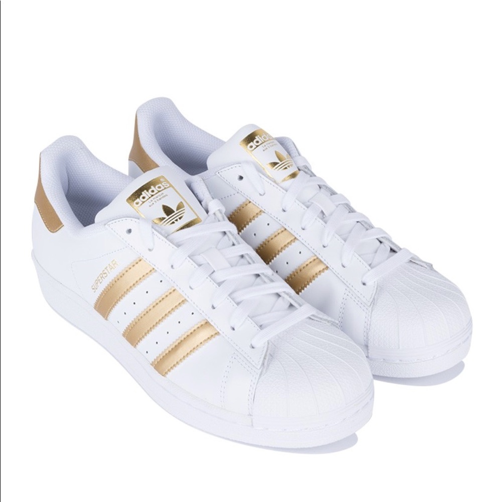 White and gold adidas superstar